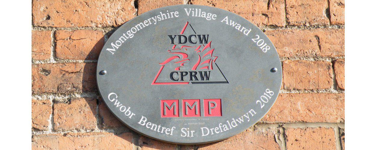 Montgomeryshire Village Award 2018 plaque at Llanymynech Village Shop